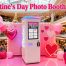 An event planner using a PhoPrint wooden photo booth at a stylish Valentine's Day party, showcasing a couple posing with festive props.