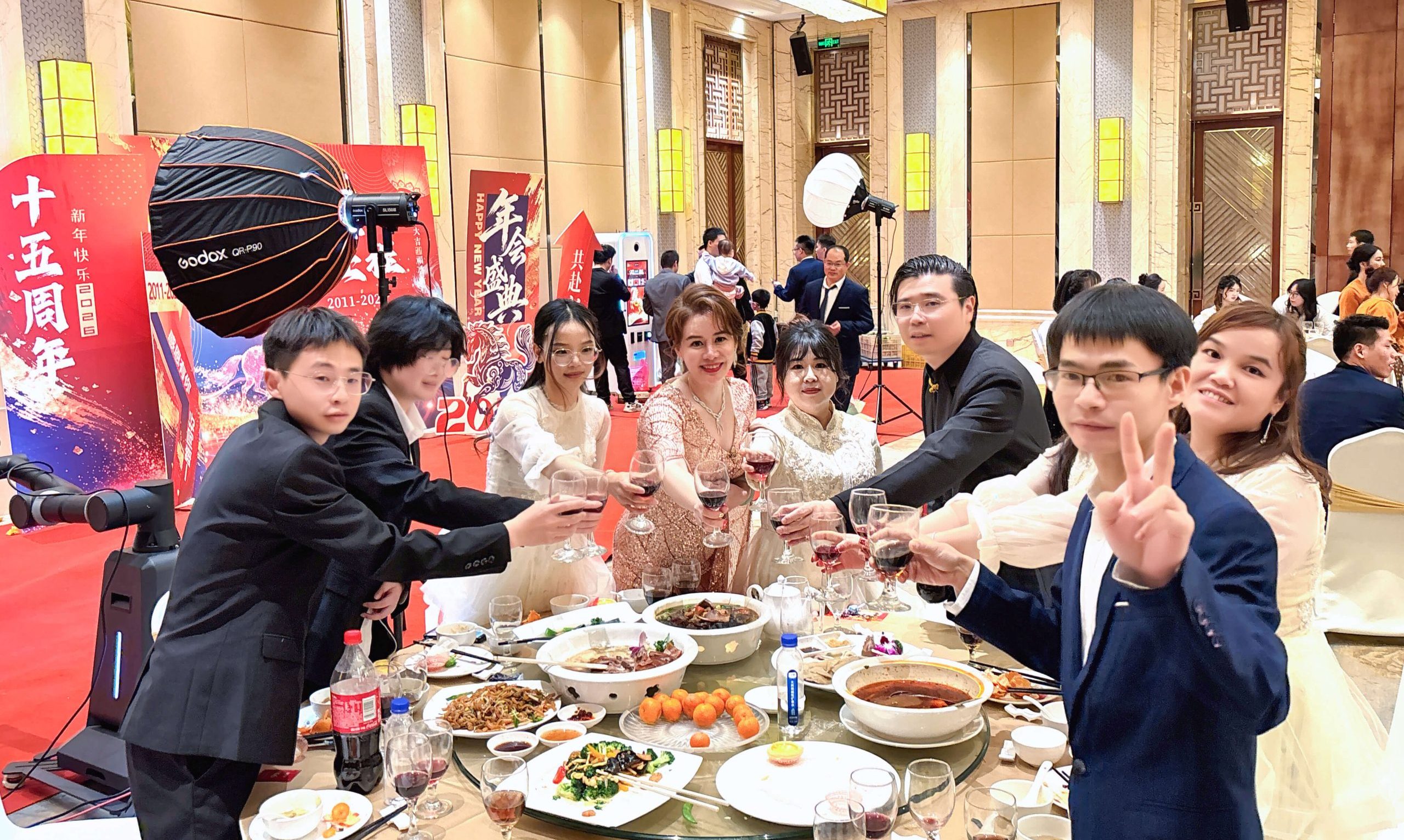 CEO Mary presenting an award to a smiling employee on stage during PhoPrint's annual celebration.