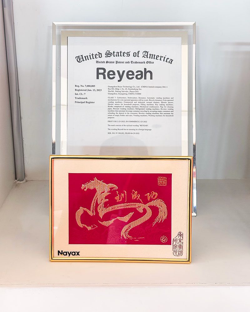 Close-up of a PhoPrint photo booth featuring an integrated Nayax card reader for cashless payments