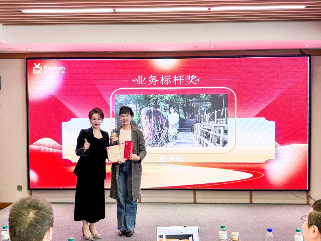 Group photo of long-term employees with CEO Mary at PhoPrint’s 15th anniversary milestone celebration.